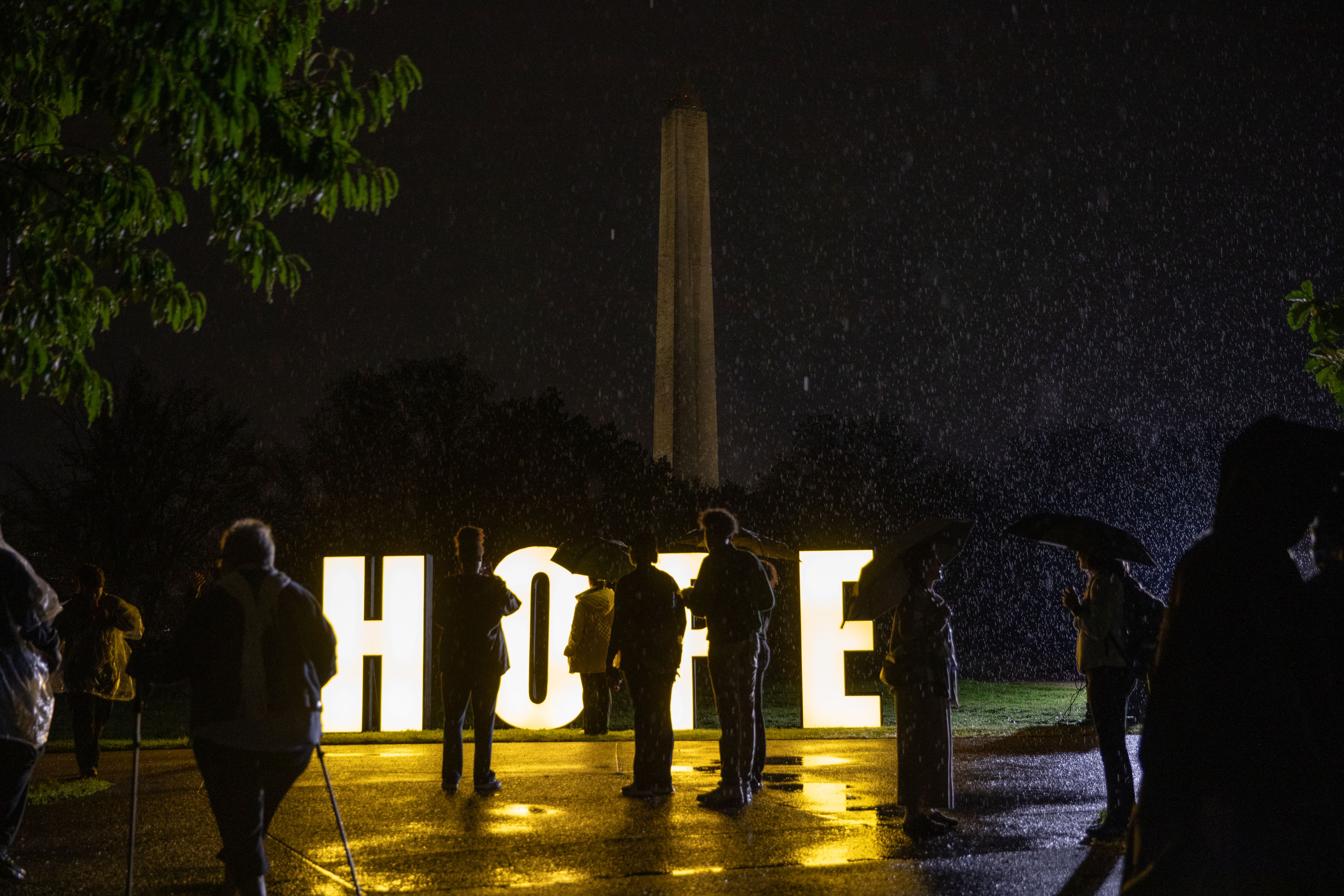 Common-ground-cancer-010 A photo of a memorial in downtown Washington D.C. Large letters that spell "HOPE" are illuminated as people walk around them.