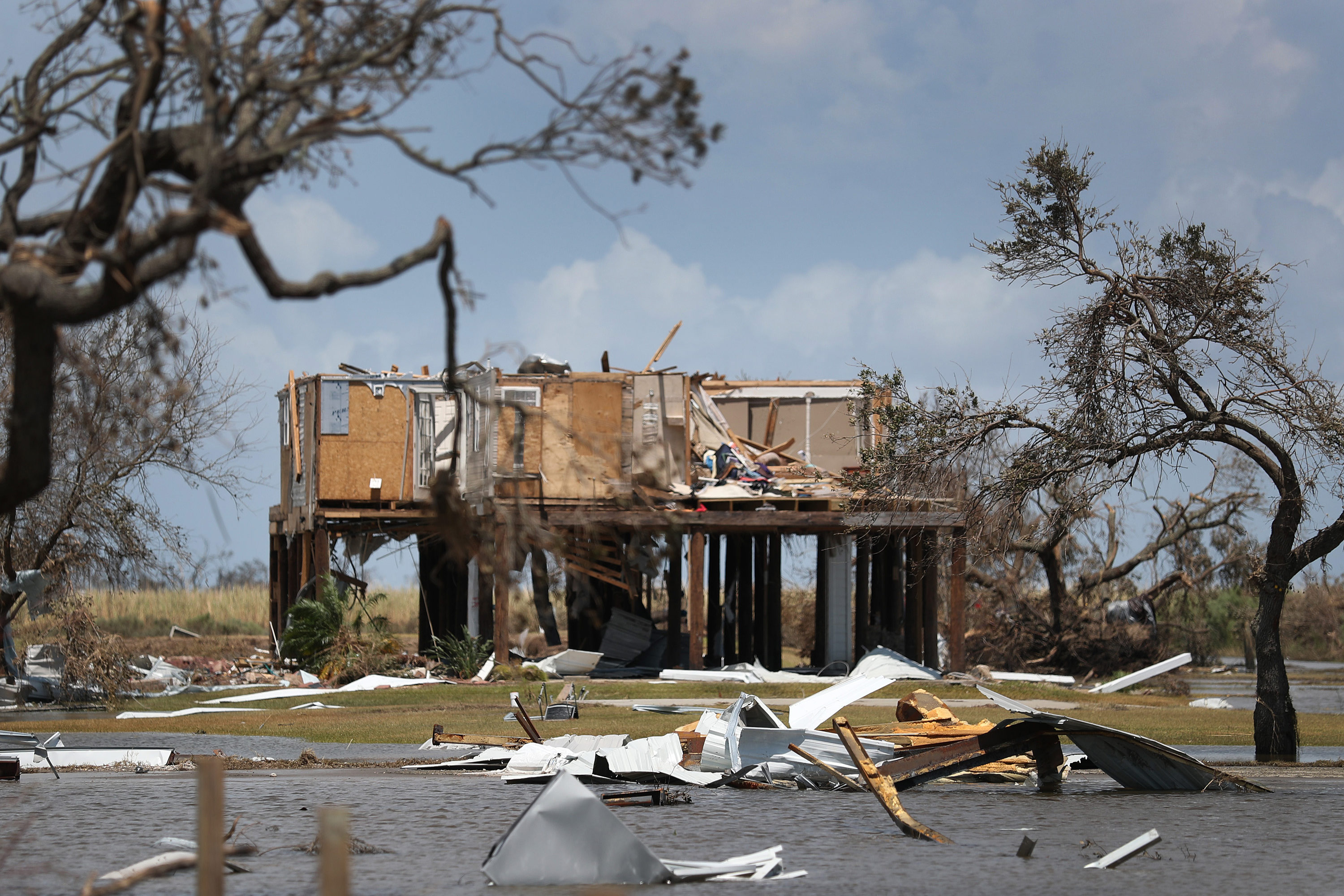GettyImages-1269572324-resized A photo of a house damaged by a hurricane.